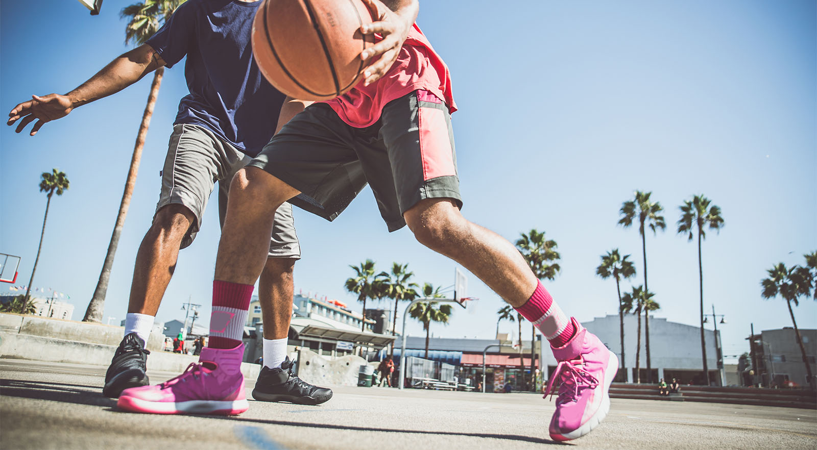 Two basketball players playing outdoor in LA